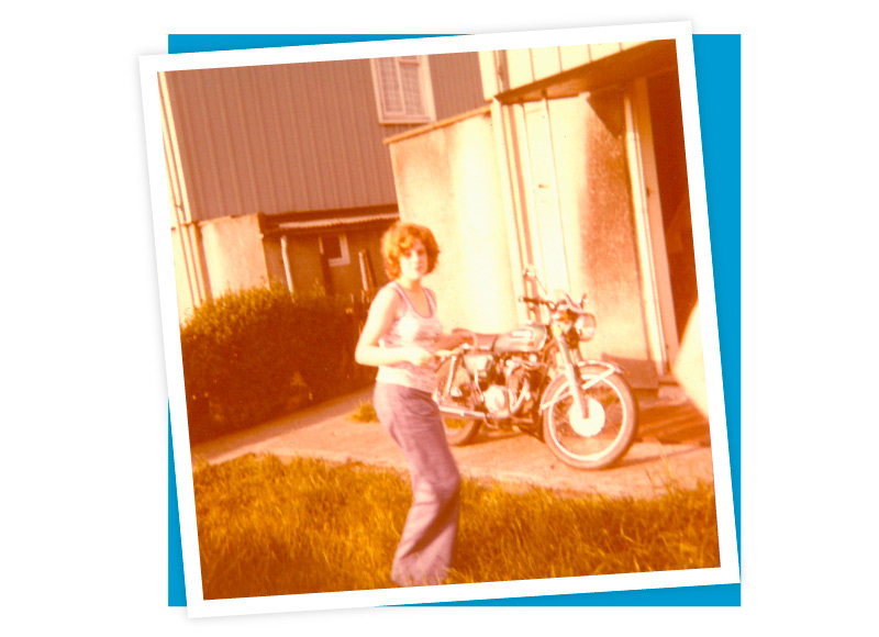 Teenage Kath poses in vest and denim flares, outside her boyfriend’s parents house in New Lodge, 1973. Image donated by Kath Parkin.
